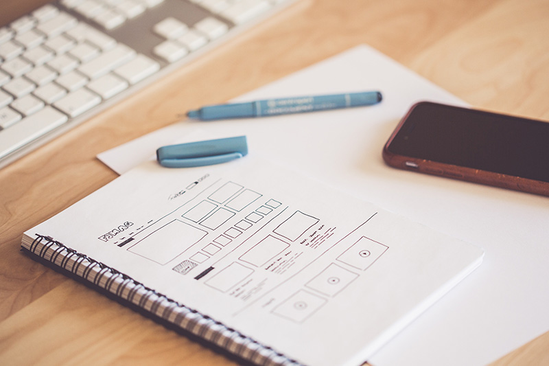 UX wireframes drawn on paper