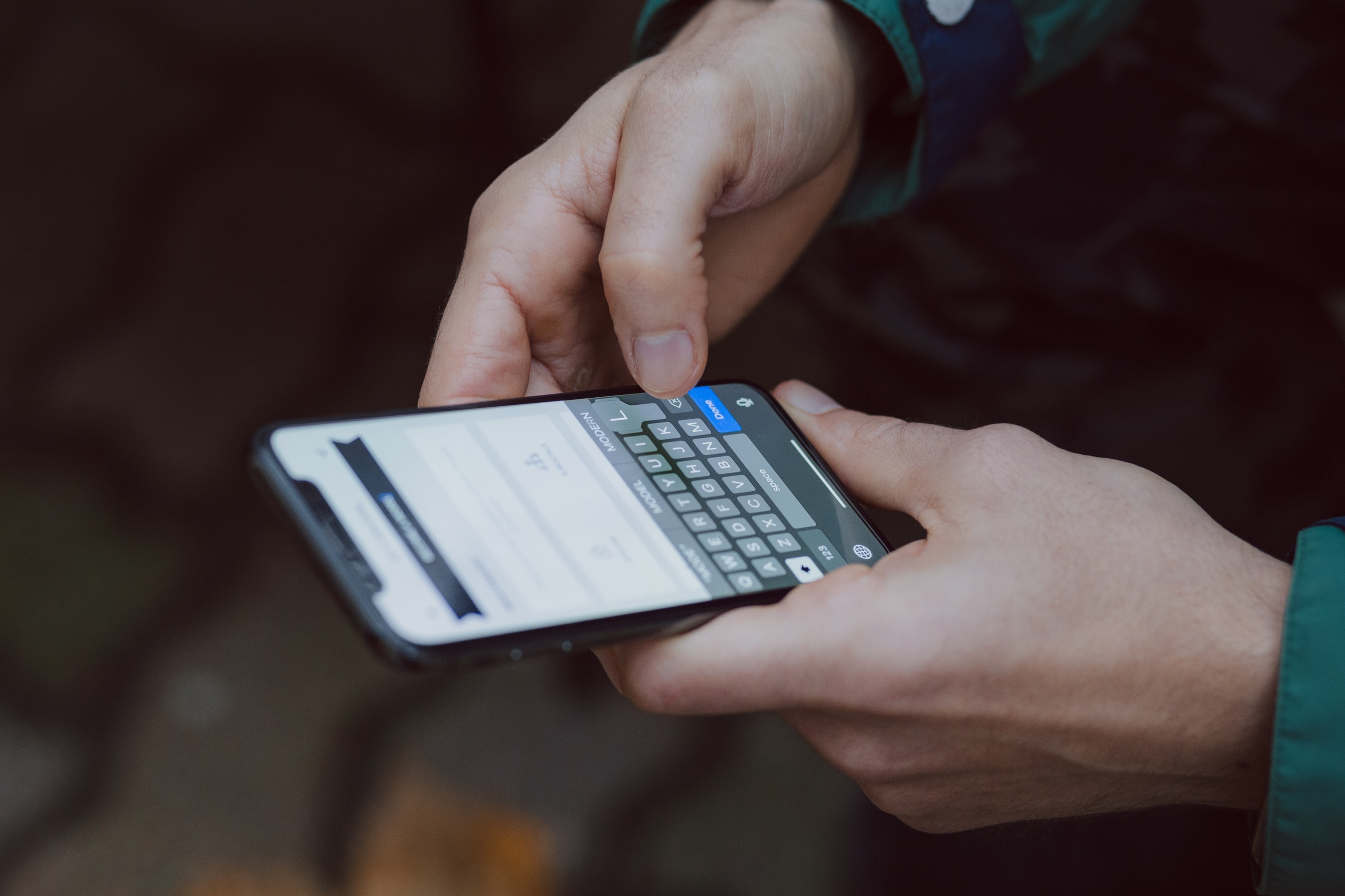 Man holding phone on an app